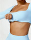 The model wearing Sky Blue Bahamas Long Sleeved Sports Crop Top slimming shaper tight lifting jumpsuit romper leggings bodysuit yoga outfit set