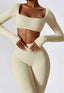 The model wearing Mojave Long Sleeved Crop Top slimming shaper tight lifting jumpsuit romper leggings bodysuit yoga outfit set