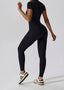 The model wearing Mojave Short Sleeve Jumpsuit slimming shaper tight lifting jumpsuit romper leggings bodysuit yoga outfit set