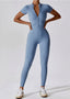 The model wearing Mojave Short Sleeve Jumpsuit slimming shaper tight lifting jumpsuit romper leggings bodysuit yoga outfit set