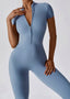 The model wearing Mojave Short Sleeve Jumpsuit slimming shaper tight lifting jumpsuit romper leggings bodysuit yoga outfit set