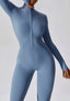 The model wearing Mojave Long Sleeved Jumpsuit slimming shaper tight lifting jumpsuit romper leggings bodysuit yoga outfit set