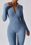 The model wearing Mojave Long Sleeved Jumpsuit slimming shaper tight lifting jumpsuit romper leggings bodysuit yoga outfit set