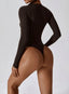 The model wearing Mojave Long Sleeve Bodysuit slimming shaper tight lifting jumpsuit romper leggings bodysuit yoga outfit set