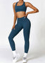 The model wearing Navy Blue Alanya 2pcs Set: High Waist Leggings & Sports Bra slimming shaper tight lifting jumpsuit romper leggings bodysuit yoga outfit set