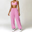 The model wearing Pink Set Malibu Yoga Set Clothes Sportswear Sports Bra & Pants - NUFIT STORE slimming shaper tight lifting jumpsuit romper leggings bodysuit yoga outfit set