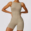 The model wearing Linen color TOKYO Seamless Rompers Jumpsuits Sportswear - NUFIT STORE slimming shaper tight lifting jumpsuit romper leggings bodysuit yoga outfit set