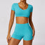 The model wearing Lake Blue Set Morocco Yoga Sets Crop Top & Stretch Shorts - NUFIT STORE slimming shaper tight lifting jumpsuit romper leggings bodysuit yoga outfit set