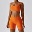 The model wearing Tropical Orange Valencia Yoga Clothing Sets Athletic Wear High Waist Shorts & Sports Bra - NUFIT STORE slimming shaper tight lifting jumpsuit romper leggings bodysuit yoga outfit set