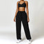 The model wearing Black Set Malibu Yoga Set Clothes Sportswear Sports Bra & Pants - NUFIT STORE slimming shaper tight lifting jumpsuit romper leggings bodysuit yoga outfit set