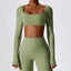 The model wearing Mojave Long Sleeved Crop Top slimming shaper tight lifting jumpsuit romper leggings bodysuit yoga outfit set