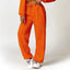 The model wearing Malibu Yoga Set Clothes Sportswear Sports Bra & Pants prisoner prison orange- NUFIT STORE slimming shaper tight lifting jumpsuit romper leggings bodysuit yoga outfit set