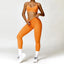 The model wearing Orange Set Malibu Yoga Set Clothes Sportswear Sports Bra & Leggings - NUFIT STORE slimming shaper tight lifting jumpsuit romper leggings bodysuit yoga outfit set