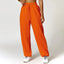 The model wearing orange Malibu Pants - NUFIT STORE slimming shaper tight lifting jumpsuit romper leggings bodysuit yoga outfit set