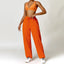 The model wearing Orange Set Malibu Yoga Set Clothes Sportswear Sports Bra & Pants prisoner prison orange- NUFIT STORE slimming shaper tight lifting jumpsuit romper leggings bodysuit yoga outfit set