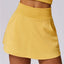 The model wearing Mango Yellow Lounge PoshFlex Skort