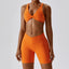 The model wearing Tropical Orange Valencia Yoga Clothing Sets Athletic Wear High Waist Shorts & Sports Bra - NUFIT STORE slimming shaper tight lifting jumpsuit romper leggings bodysuit yoga outfit set