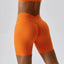 The model wearing Tropical Orange Valencia Athletic Wear High Waist Shorts - NUFIT STORE back view slimming shaper tight lifting jumpsuit romper leggings bodysuit yoga outfit set