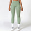 The model wearing Basil green Tribeca Sport Leggings - NUFIT STORE slimming shaper tight lifting jumpsuit romper leggings bodysuit yoga outfit set