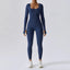 The model wearing navy blue Seamless Yoga Suit Women's Bodysuit Spring Dance Fitness Clothes Gym Push Up Workout Bodysuit Tight Long-Sleeved Athletic Wear - NUFIT STORE slimming shaper tight lifting jumpsuit romper leggings bodysuit yoga outfit set