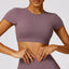 The model wearing Dousha Purple Bali Crop Top Short Sleeve - NUFIT STORE slimming shaper tight lifting jumpsuit romper leggings bodysuit yoga outfit set