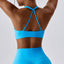 The model wearing Wynwood Seamless Yoga Fitness Sports Bra - NUFIT STORE front view slimming shaper tight lifting jumpsuit romper leggings bodysuit yoga outfit set