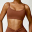 The model wearing Caramel brown Portofino Sports Bra - NUFIT STORE slimming shaper tight lifting jumpsuit romper leggings bodysuit yoga outfit set