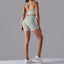 The model wearing light gray Maui Seamless Set Sports Bra & Shorts - NUFIT STORE slimming shaper tight lifting jumpsuit romper leggings bodysuit yoga outfit set