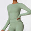 The model wearing Basil green Tribeca Long Sleeves - NUFIT STORE slimming shaper tight lifting jumpsuit romper leggings bodysuit yoga outfit set