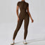 The model wearing Mojave Short Sleeve Jumpsuit slimming shaper tight lifting jumpsuit romper leggings bodysuit yoga outfit set